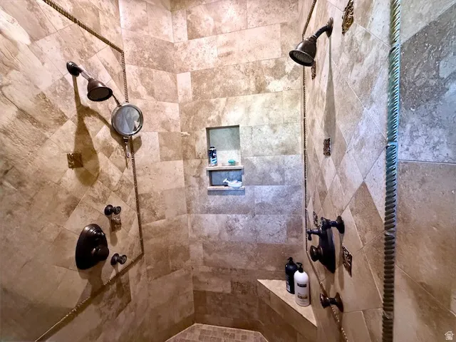Bathroom featuring a tile shower