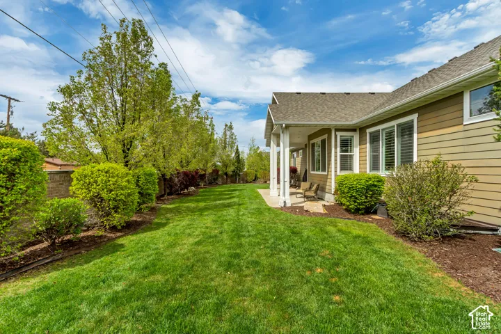 Fenced backyard with a patio