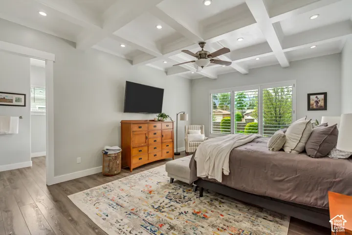Bedroom featuring coffered ceiling, recessed lighting, wood finished floors, and a ceiling fan