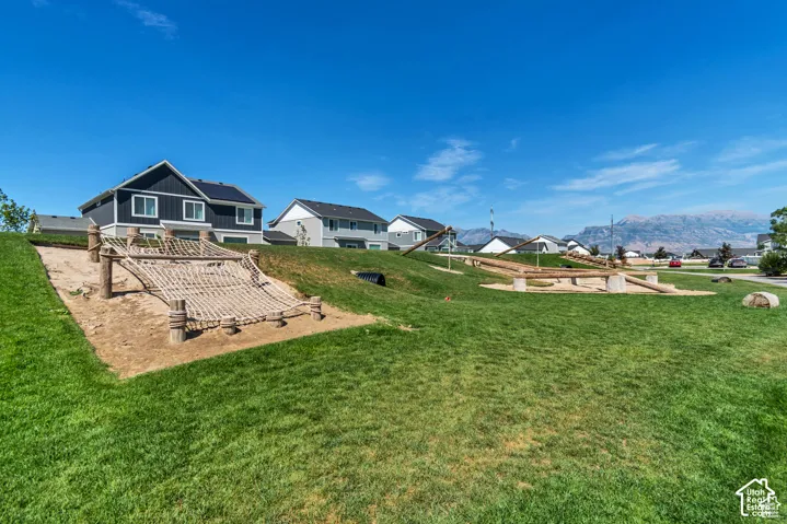 View of green lawn featuring a patio area