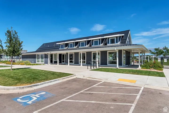 View of property featuring uncovered parking