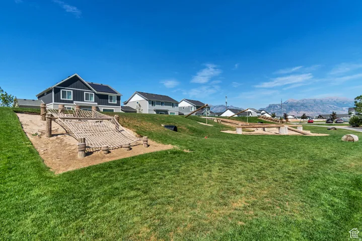 View of green lawn featuring a patio area