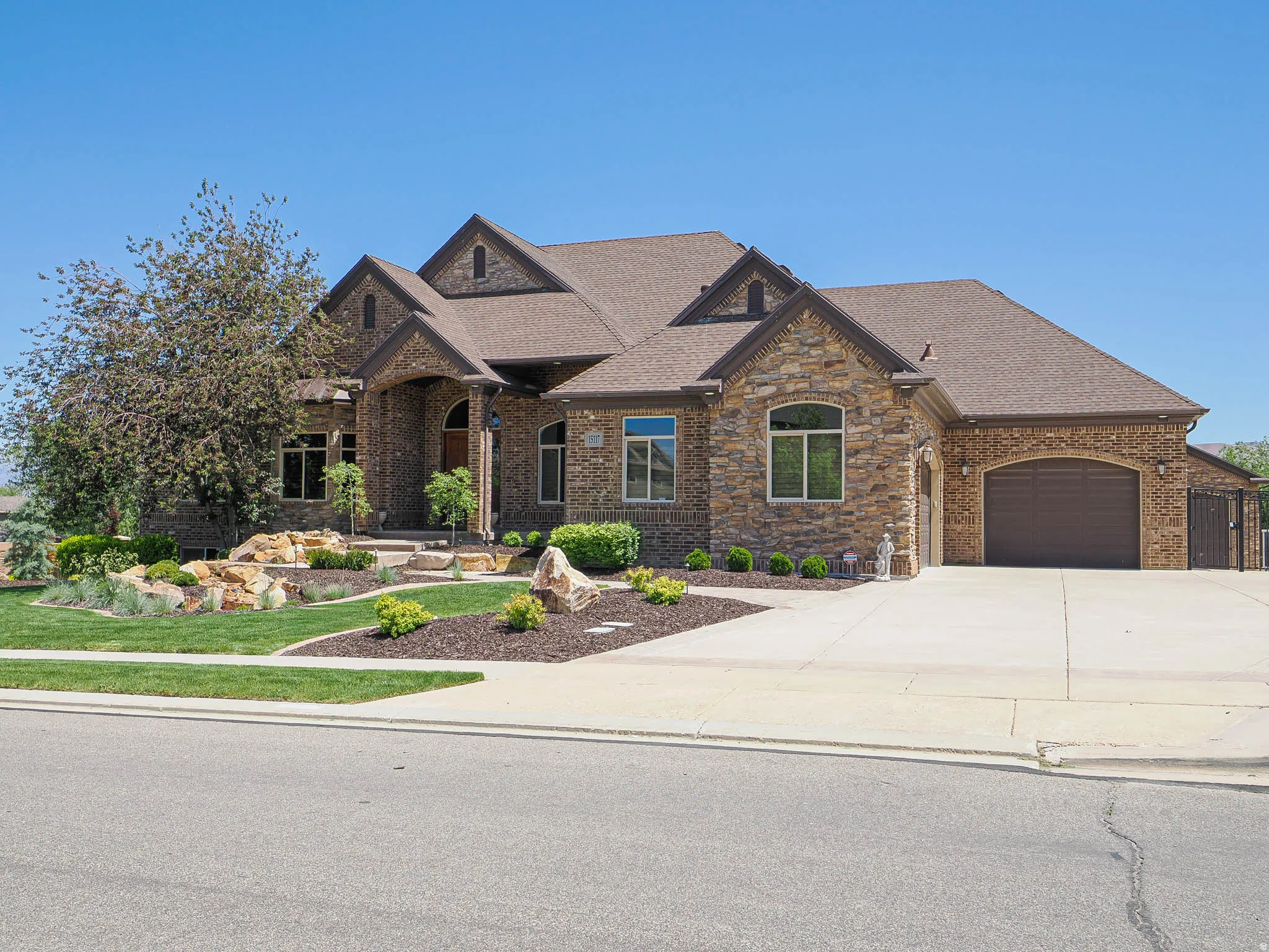 Stone and brick facade with an arched entry