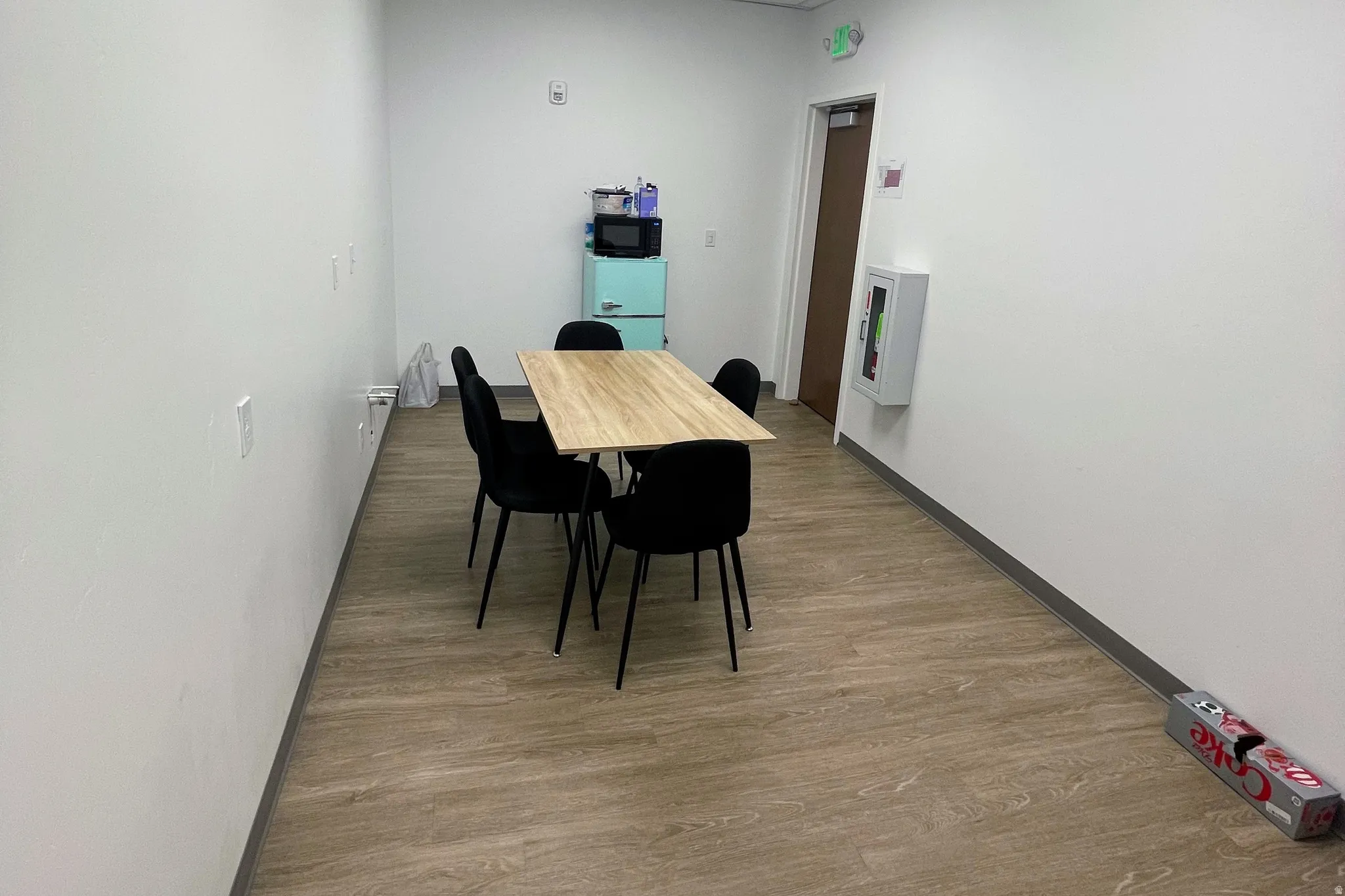 Dining area with wood finished floors and baseboards