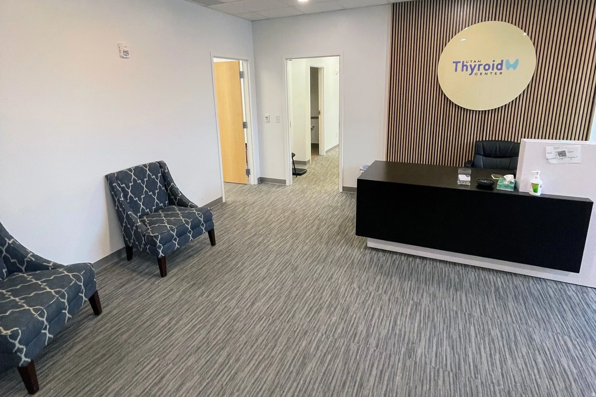 Welcome area with a drop ceiling and recessed lighting