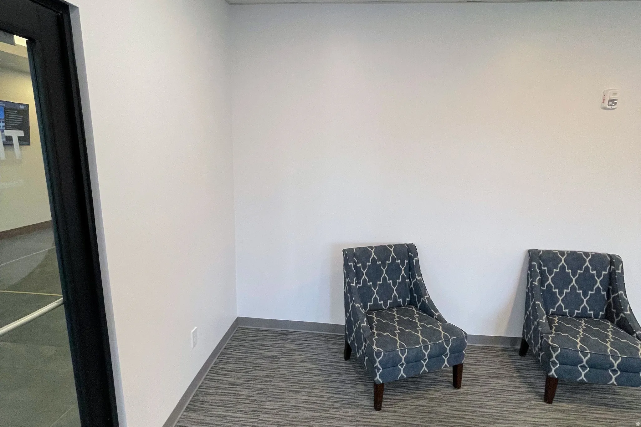 Sitting room featuring baseboards