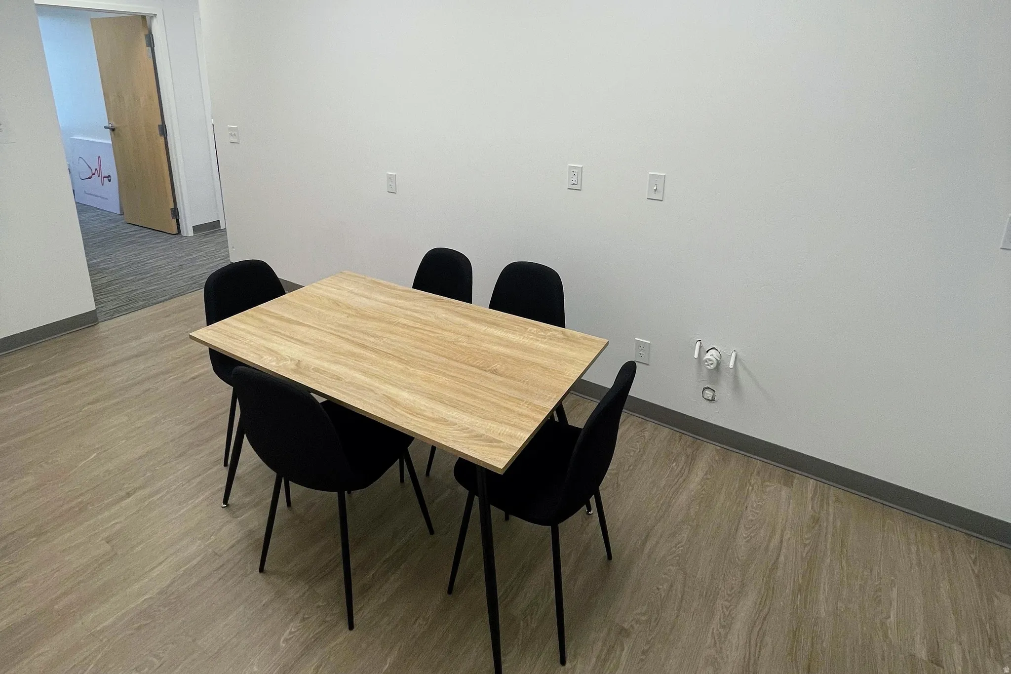 Dining area with baseboards and light wood-type flooring