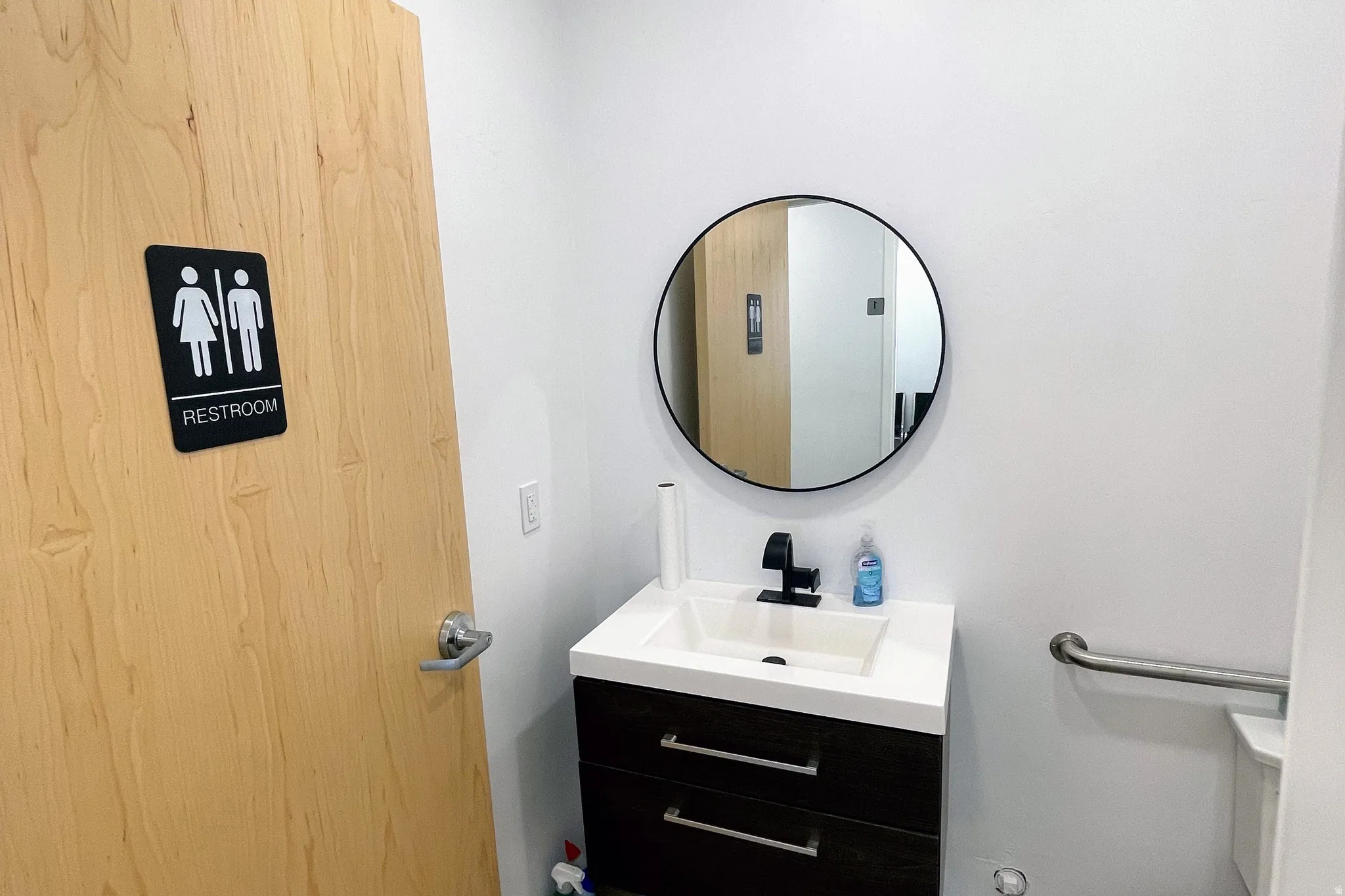 Half bathroom featuring vanity