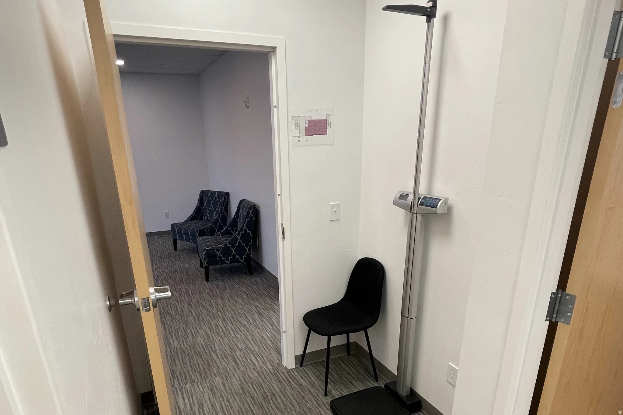 Hallway featuring carpet