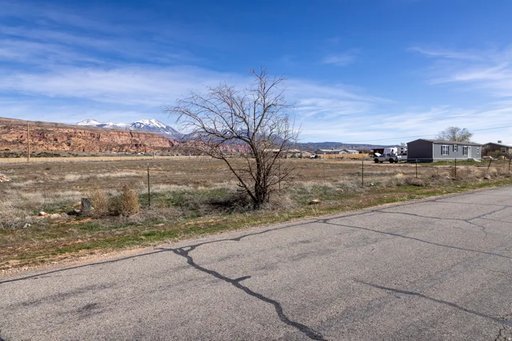 View of asphalt street with a mountain view