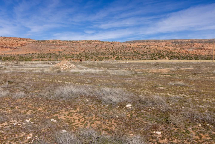 View of mountain background featuring rural landscape