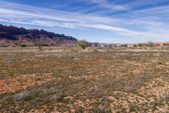 View of mountain backdrop featuring rural landscape