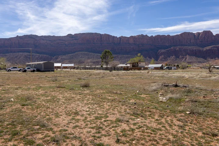 View of mountain backdrop with rural landscape