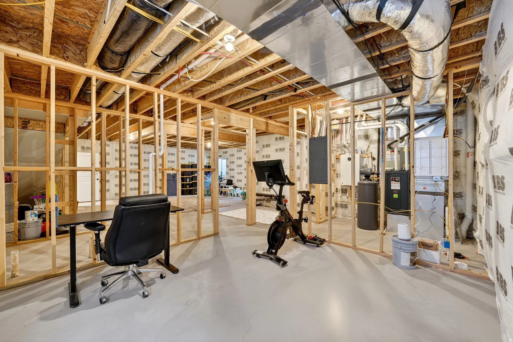 Unfinished basement featuring electric panel