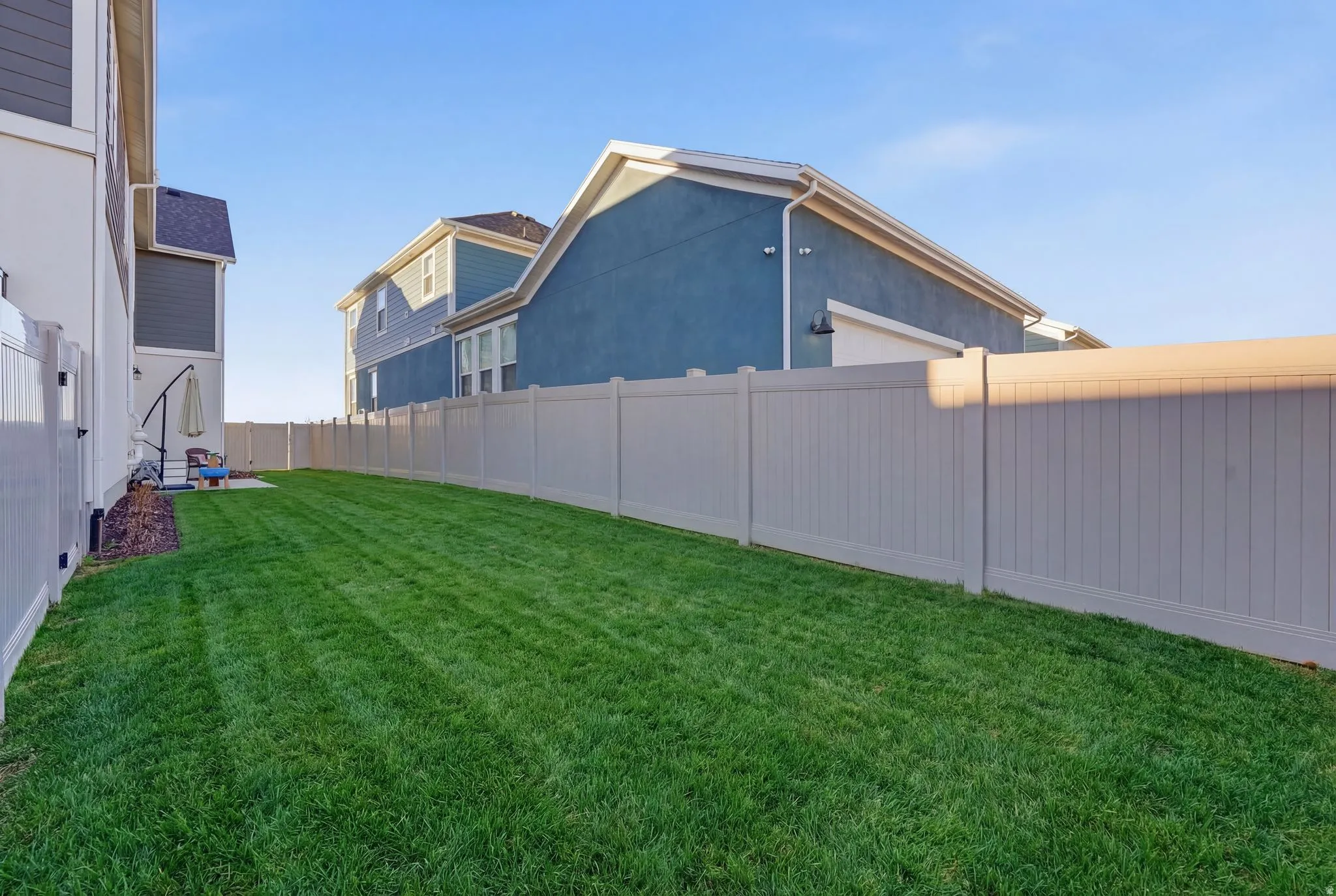 View of fenced backyard