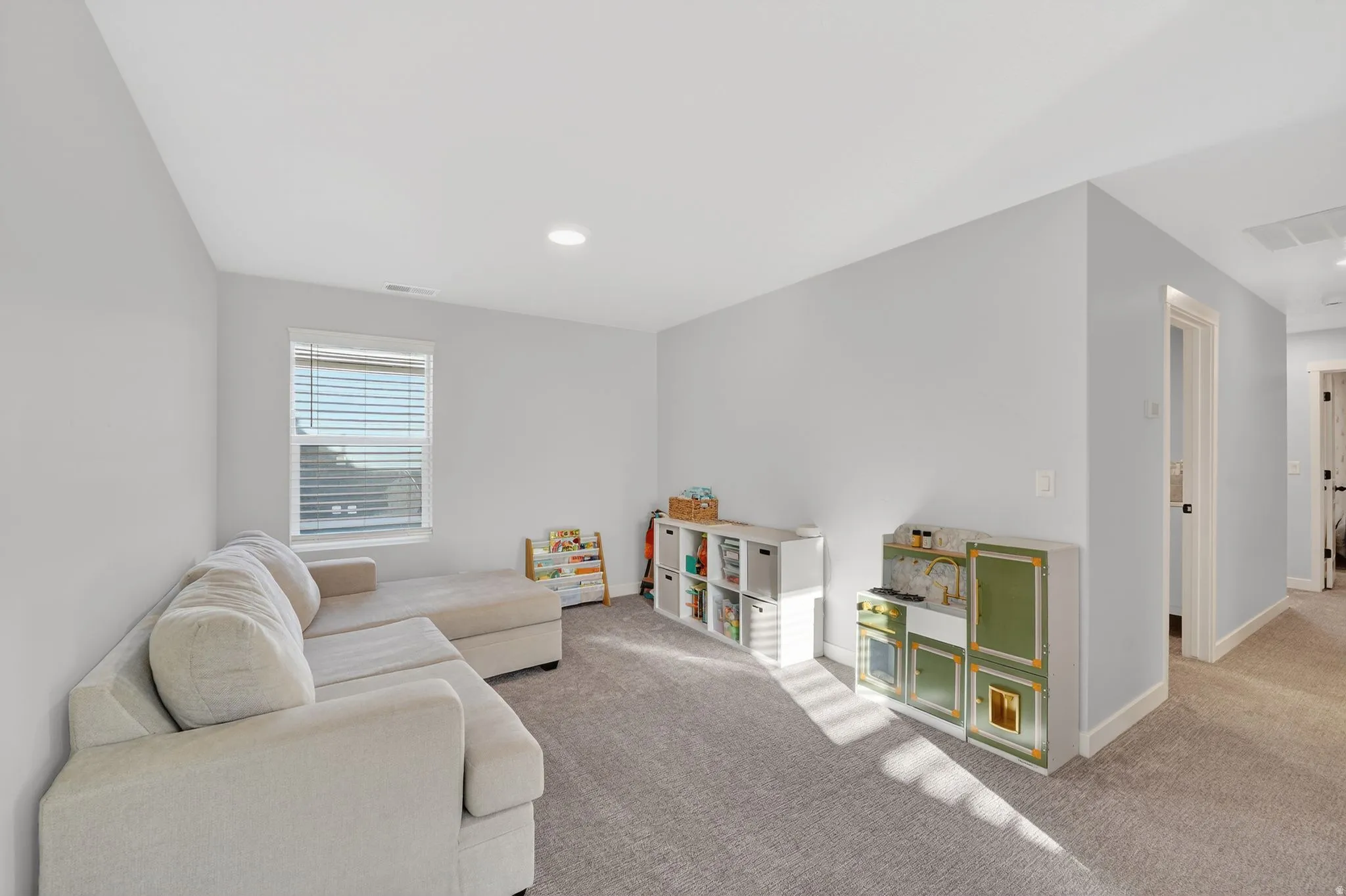 Living room with carpet and baseboards