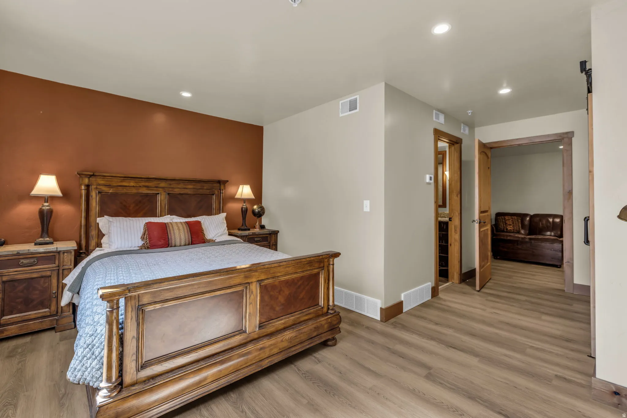 Bedroom with light wood-type flooring and recessed lighting
