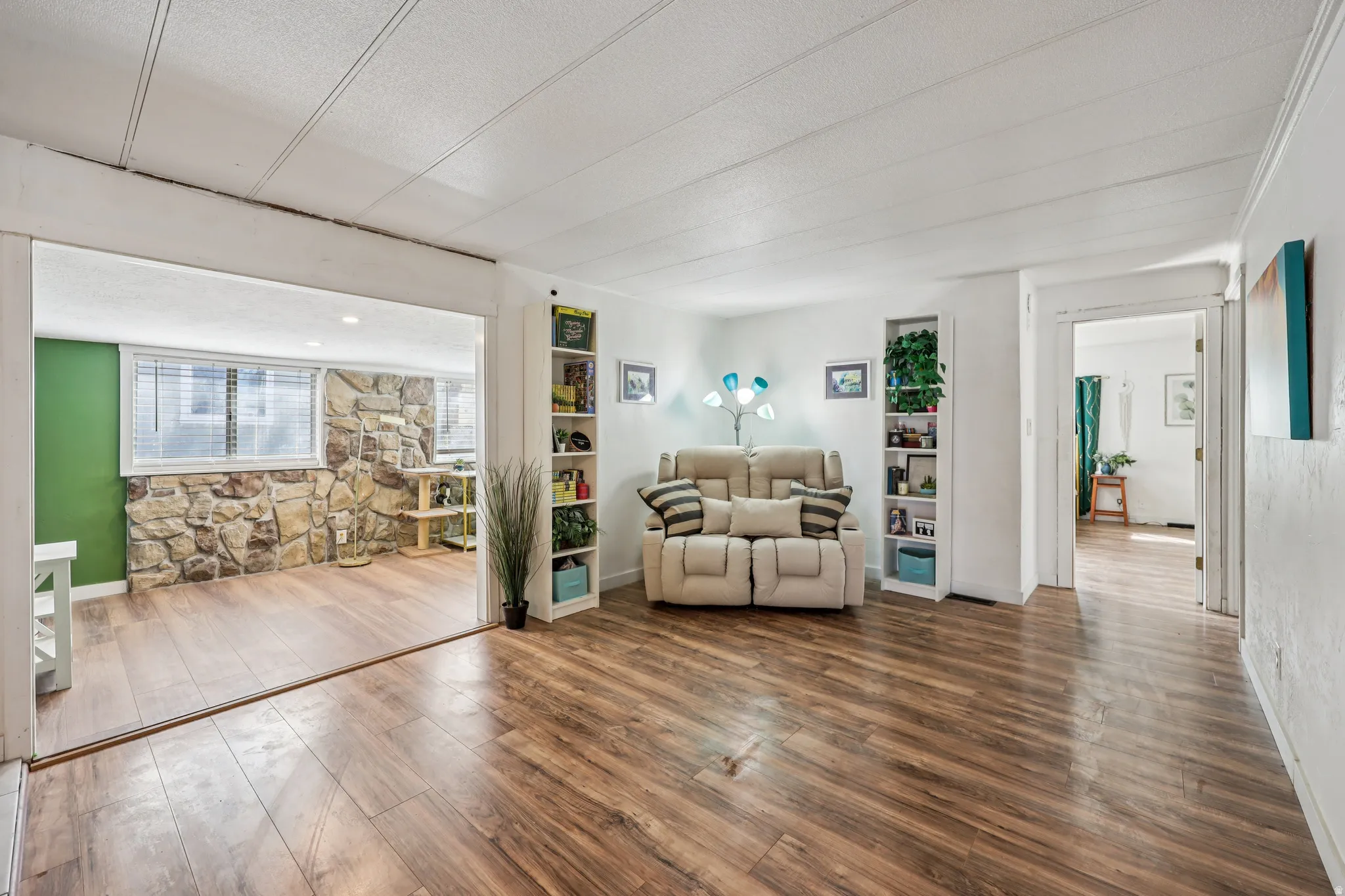 Sitting room featuring wood finished floors and a textured ceiling
