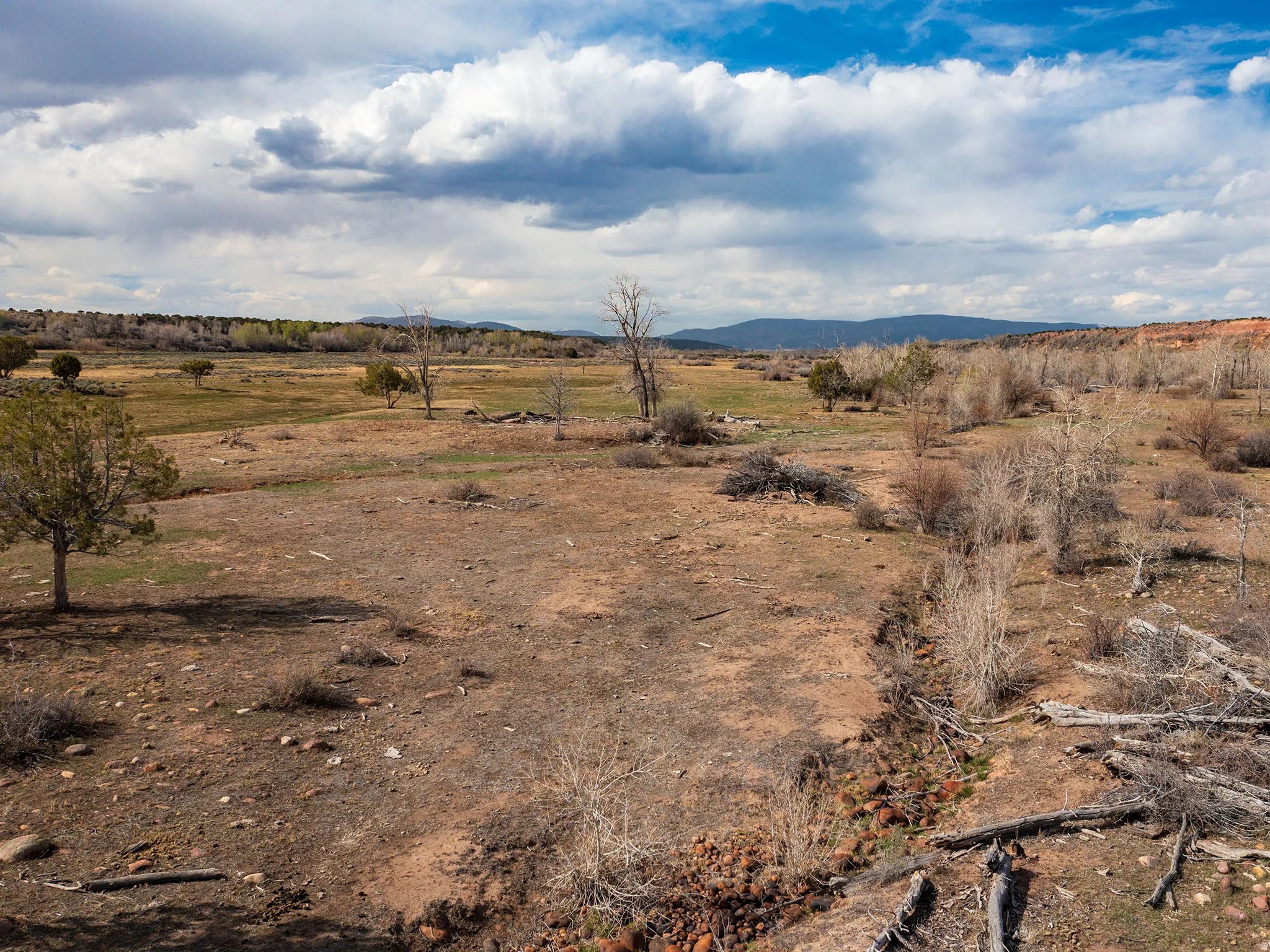 View of mountain background featuring rural landscape