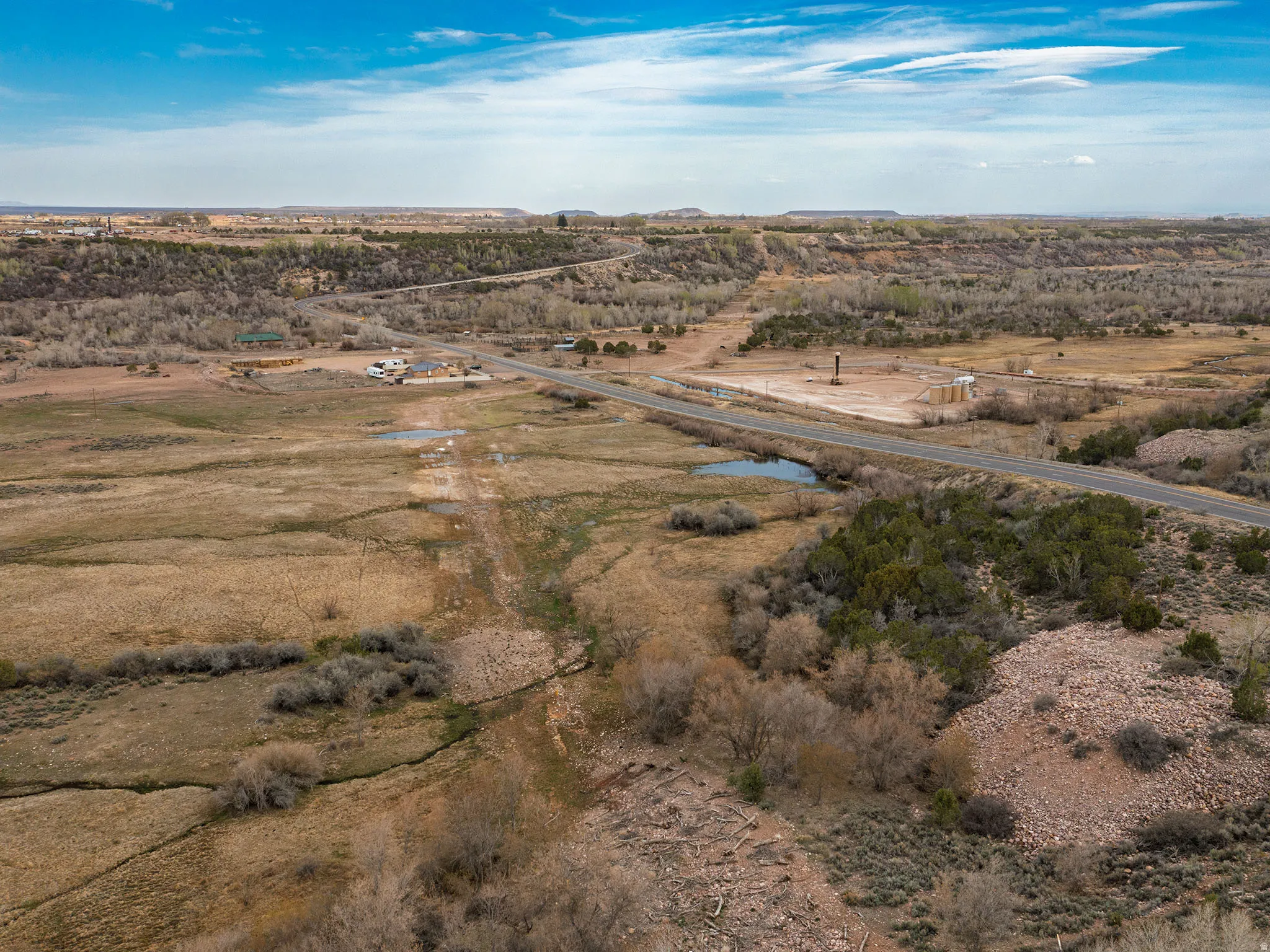 Overview of rural landscape with a nearby body of water