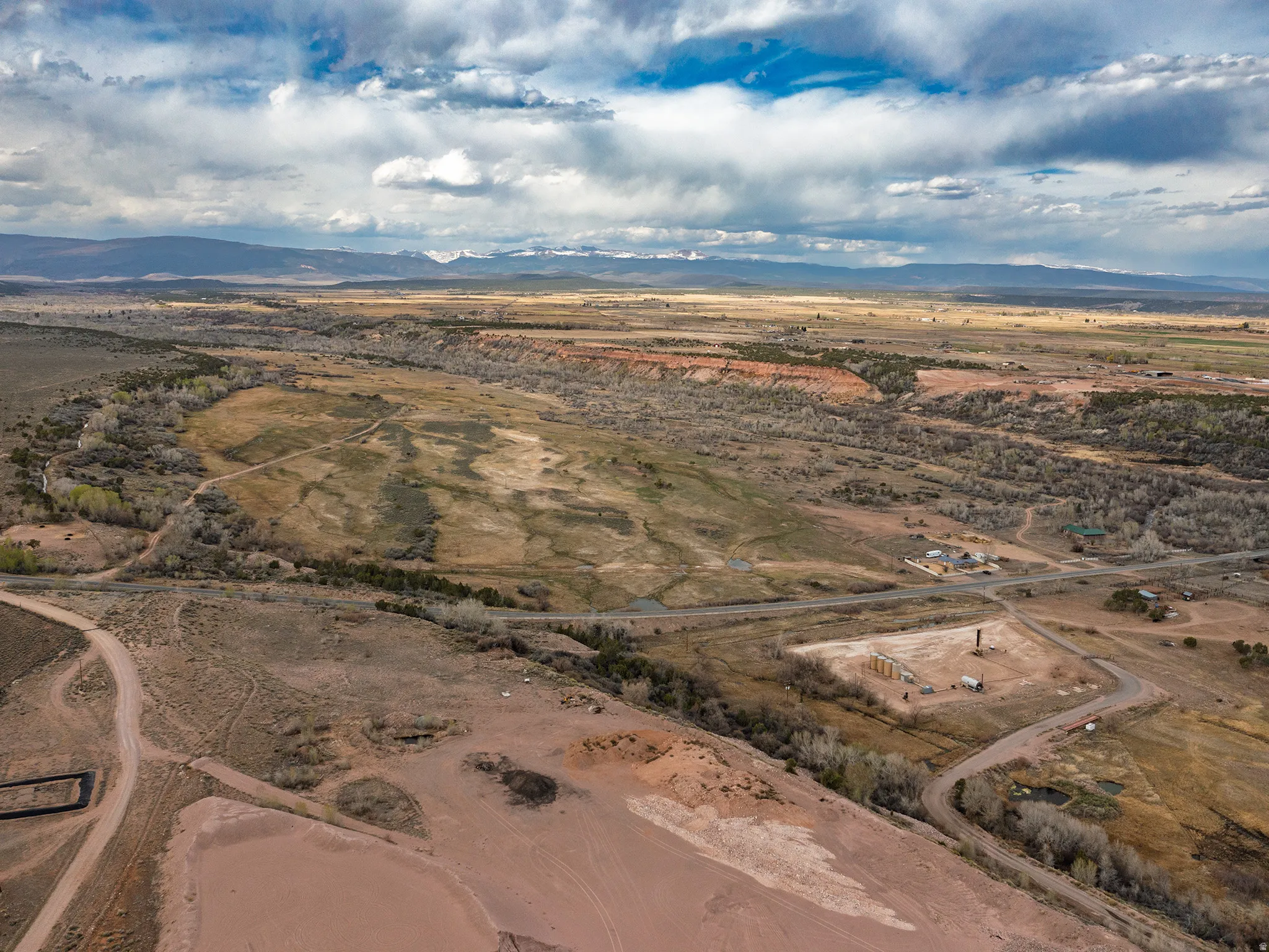 Aerial view of sparsely populated area featuring a desert landscape and mountains