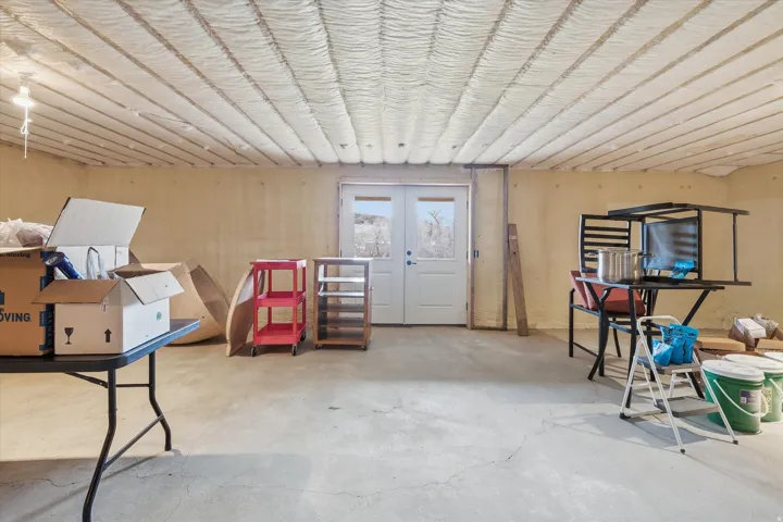 Below grade area featuring french doors