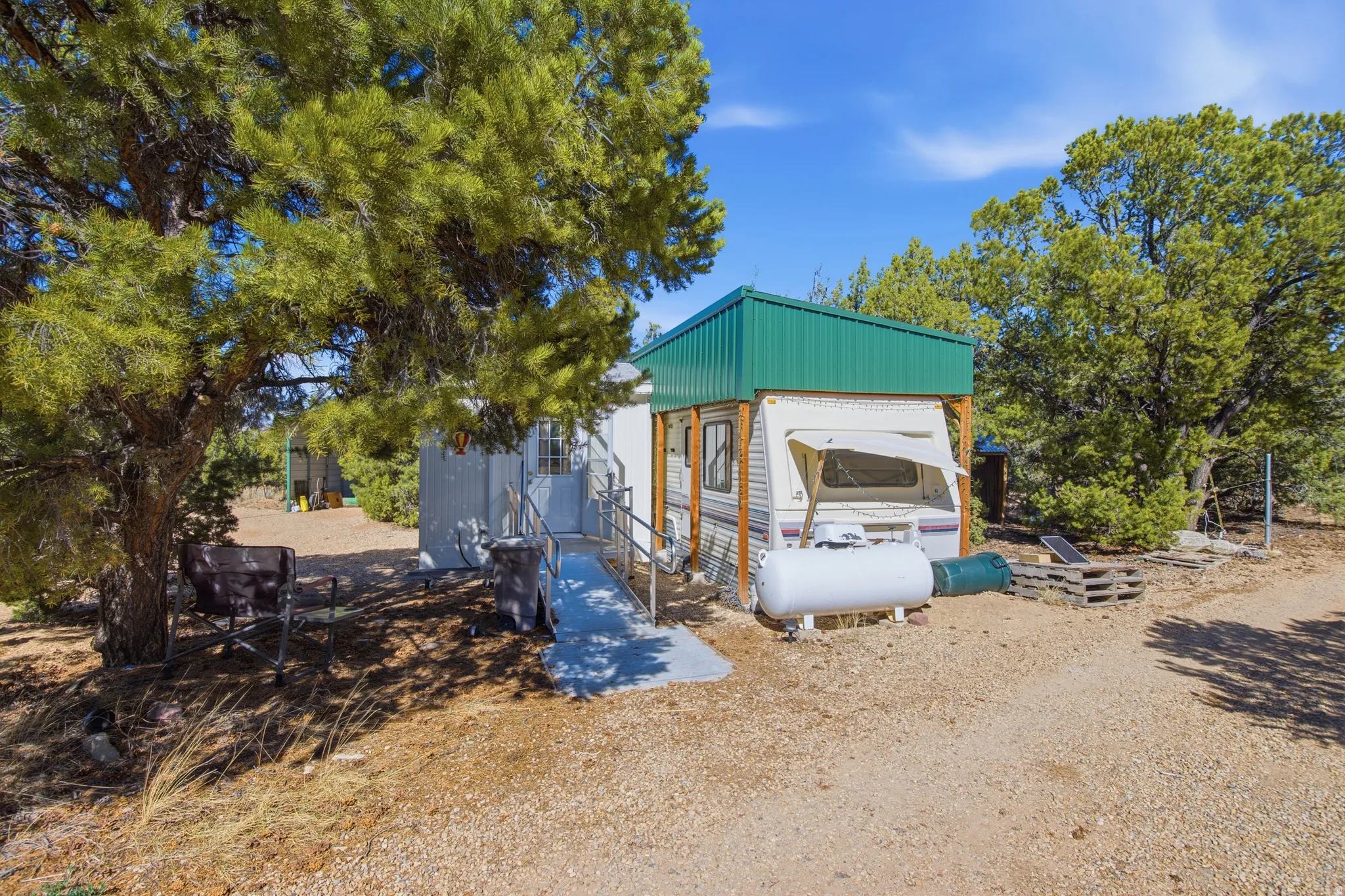 View of front of home with an outbuilding