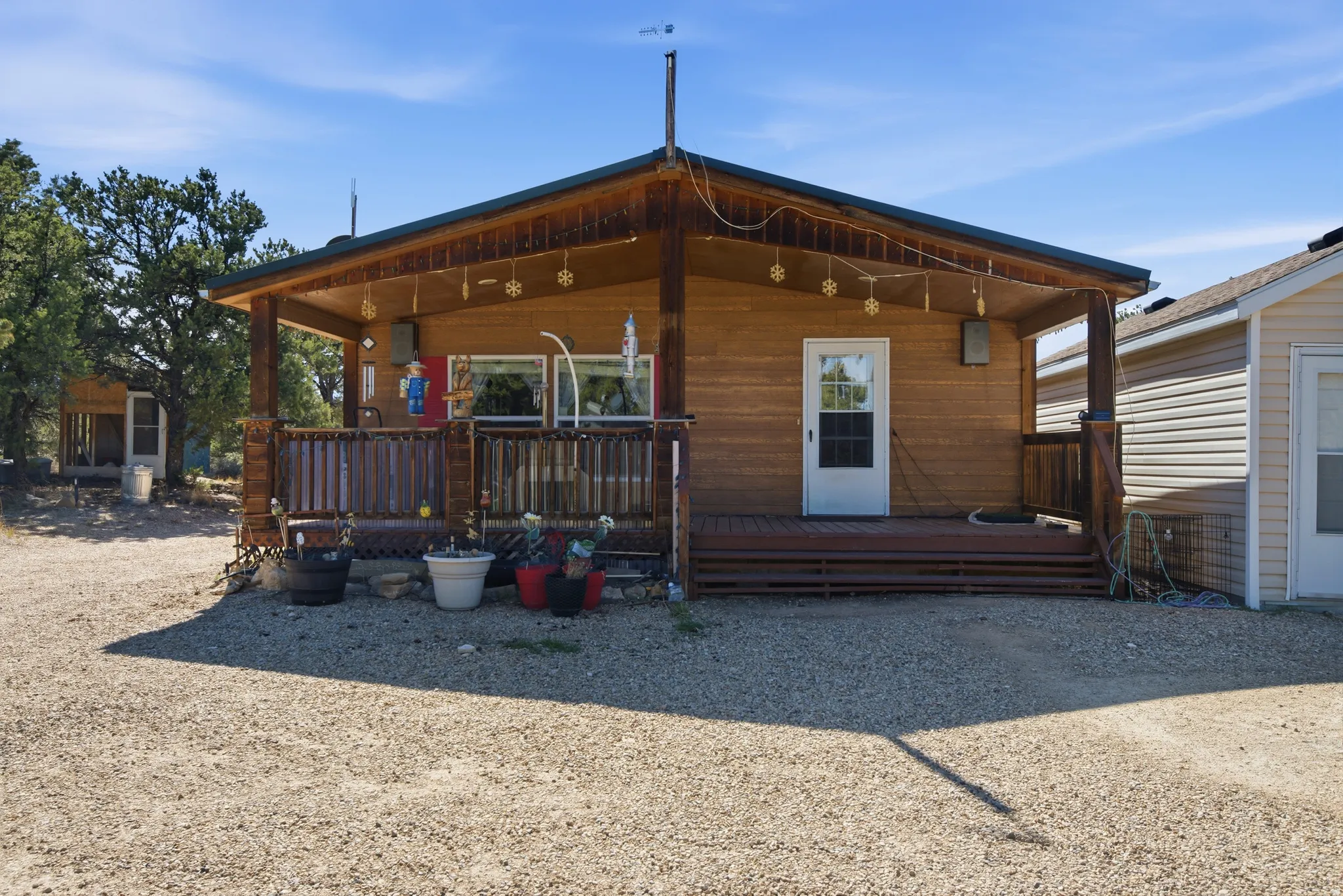 Back of house featuring covered porch