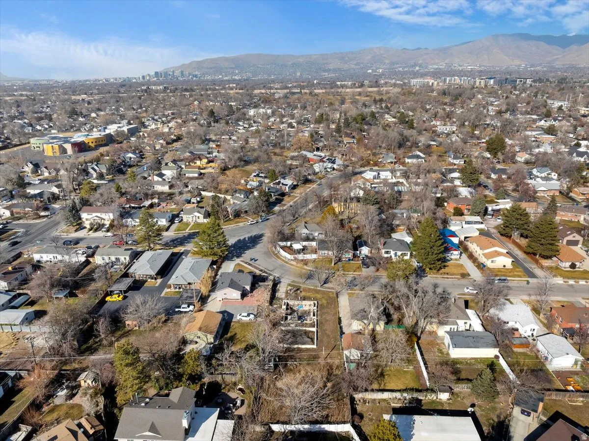 Aerial view of residential area featuring mountains
