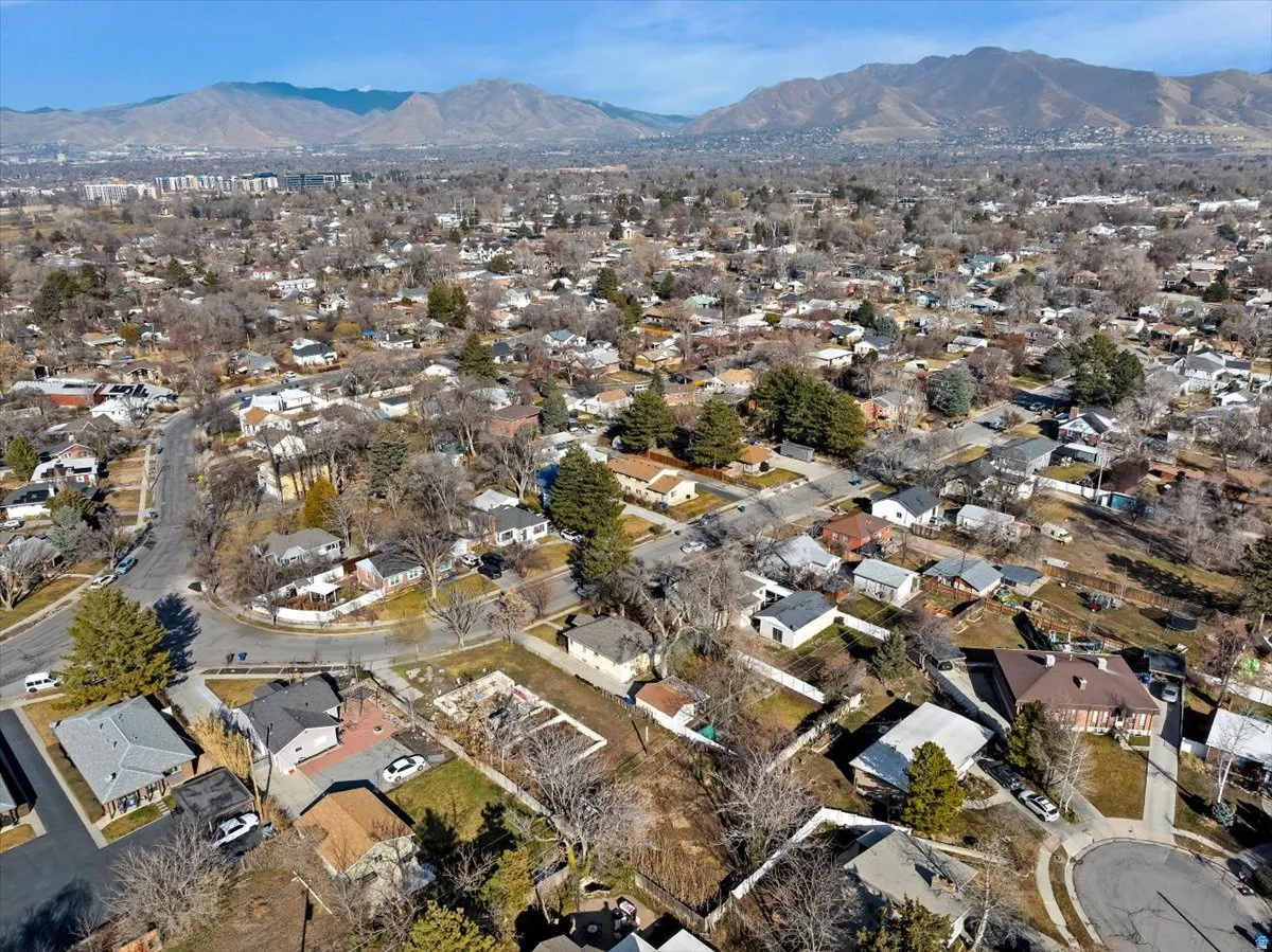 Aerial view of residential area featuring mountains