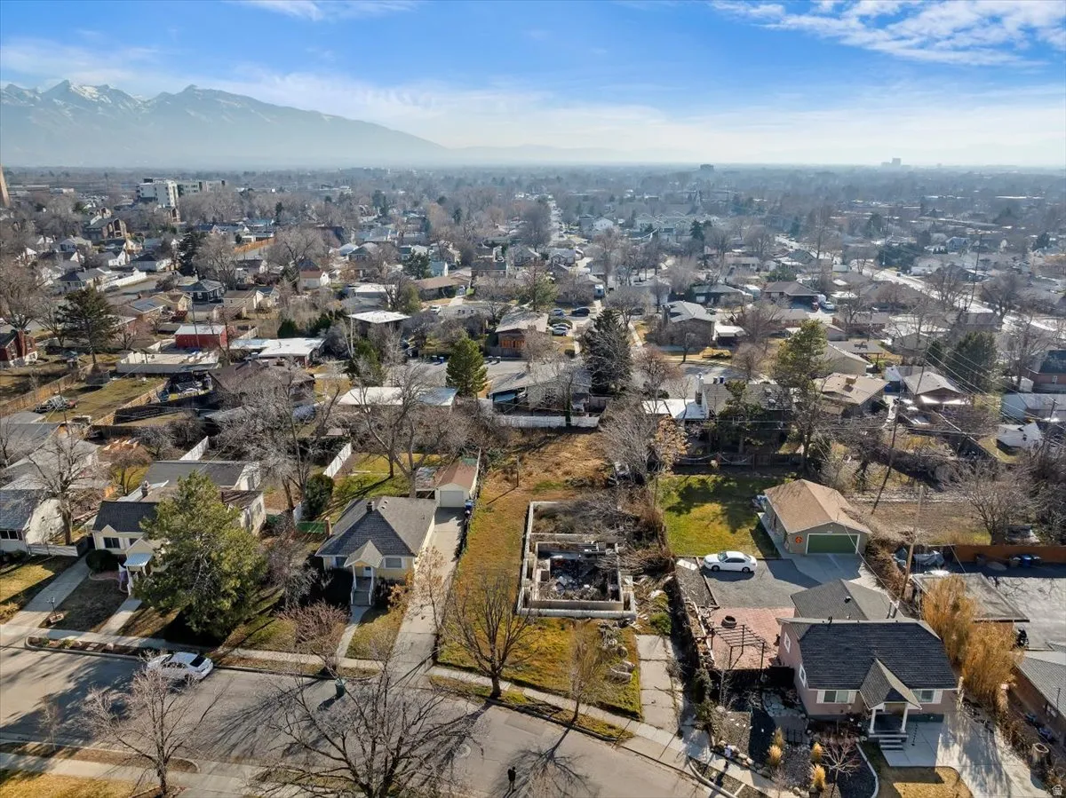 Aerial perspective of suburban area with a mountain backdrop