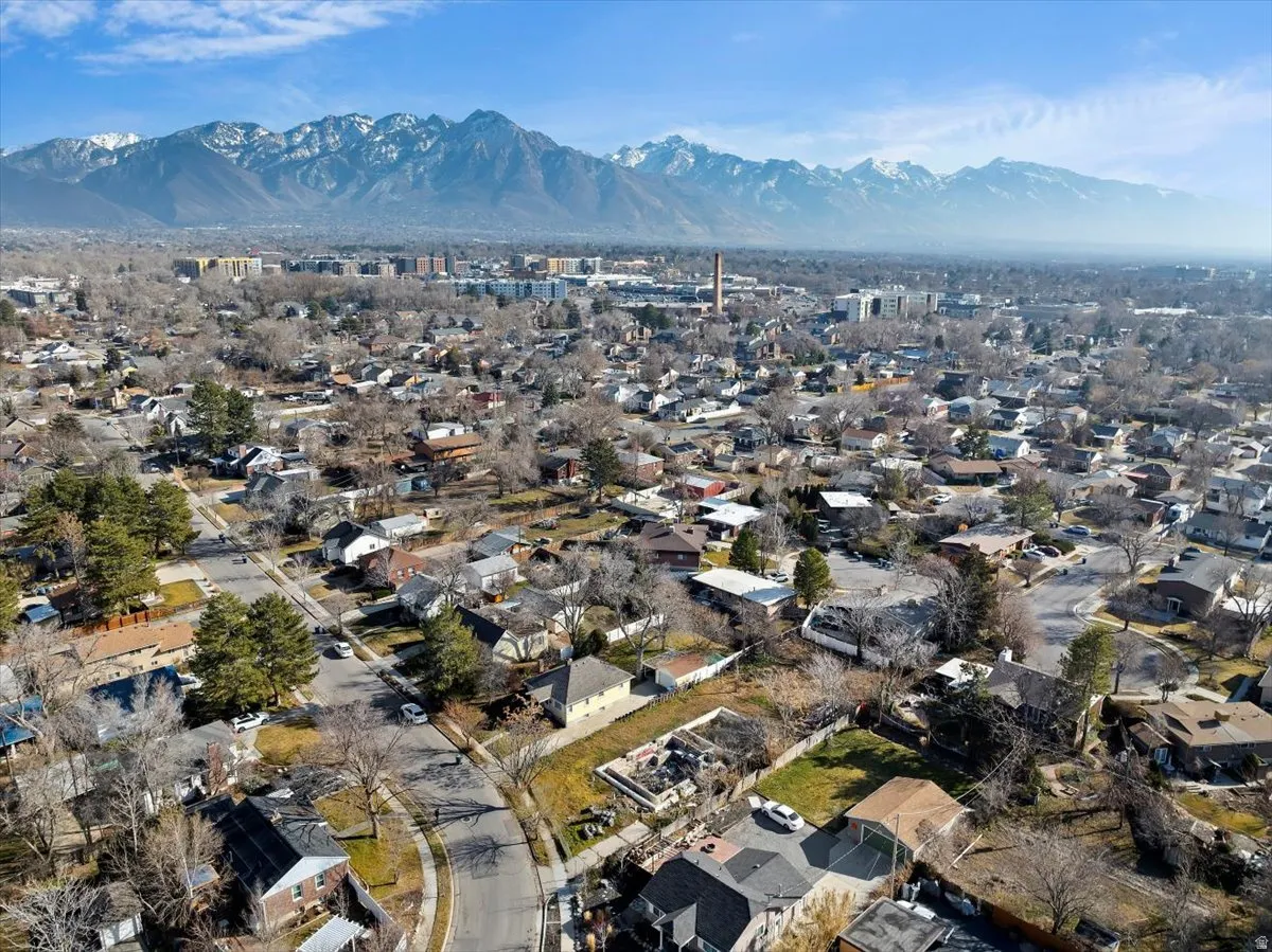 Aerial perspective of suburban area with a mountainous background