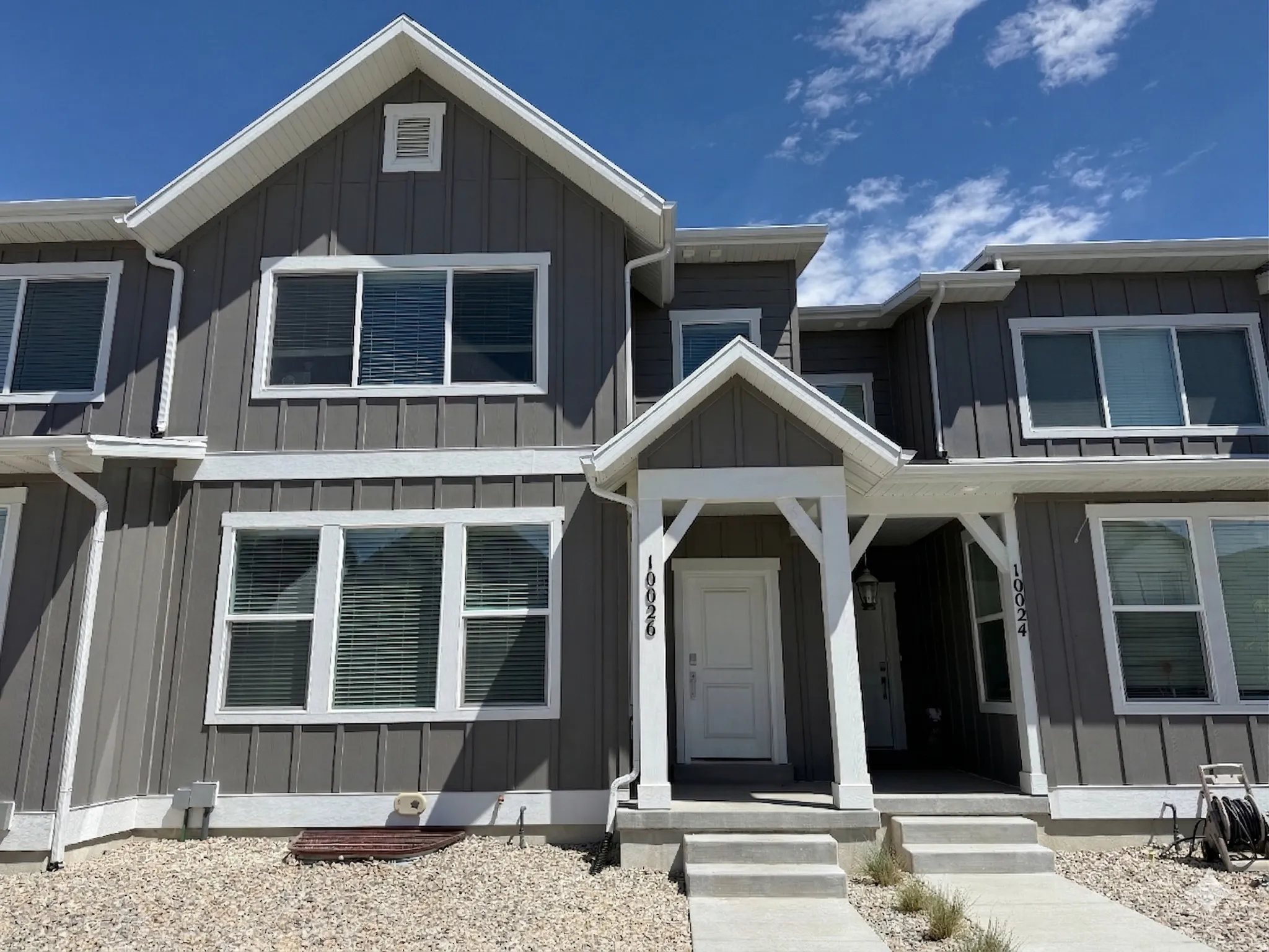 View of front facade featuring board and batten siding