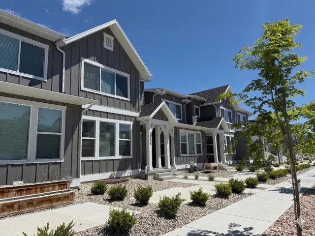 View of front of property featuring board and batten siding and covered porch
