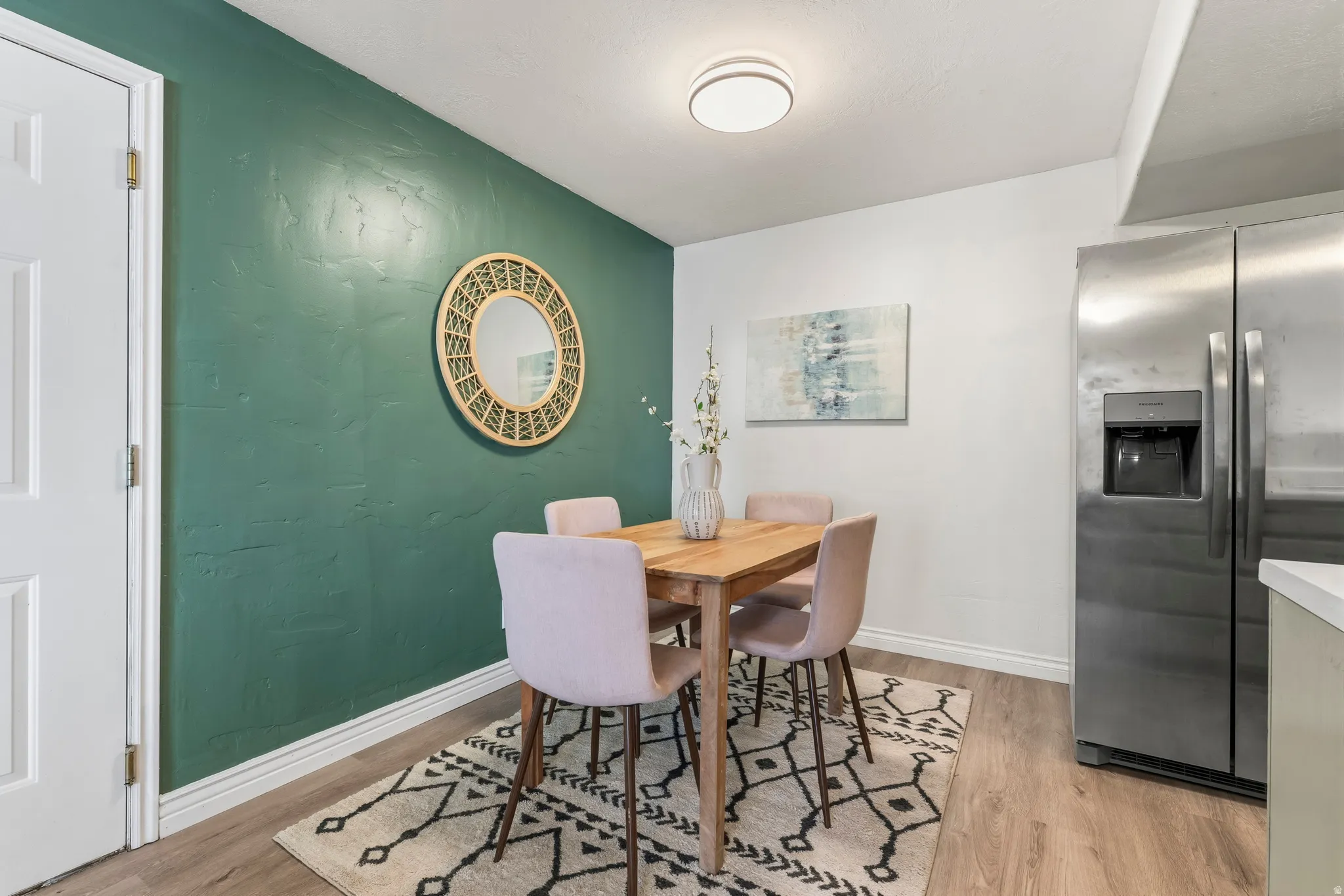 Dining space featuring light wood-style floors