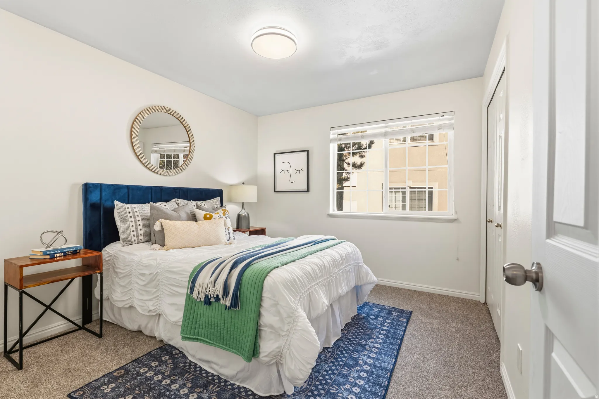 Bedroom featuring carpet floors and a closet