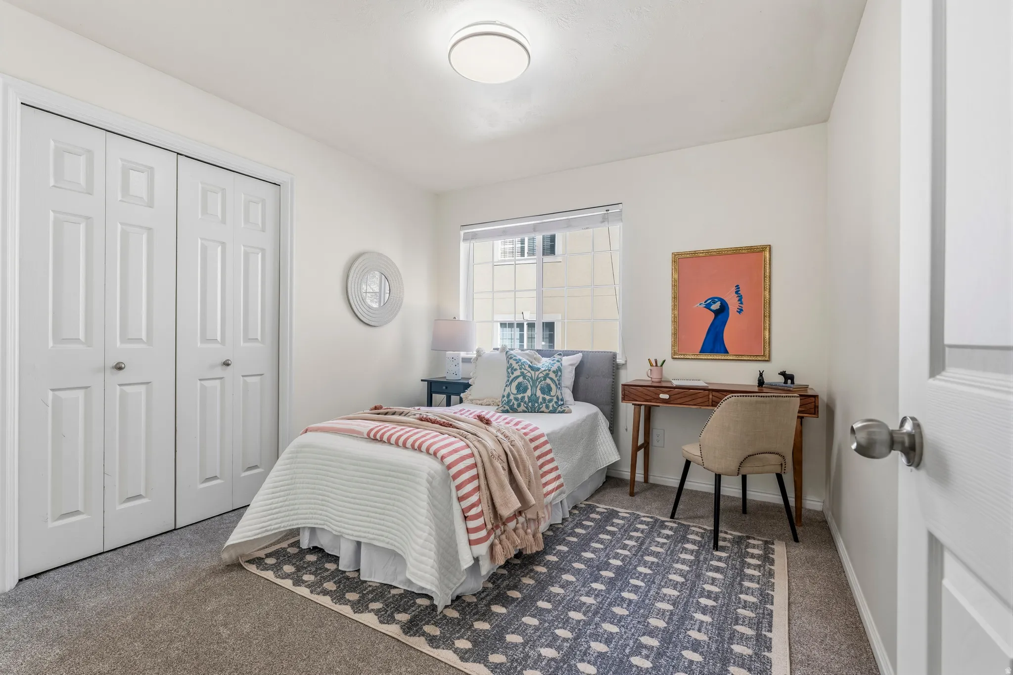 Bedroom with dark carpet and a closet