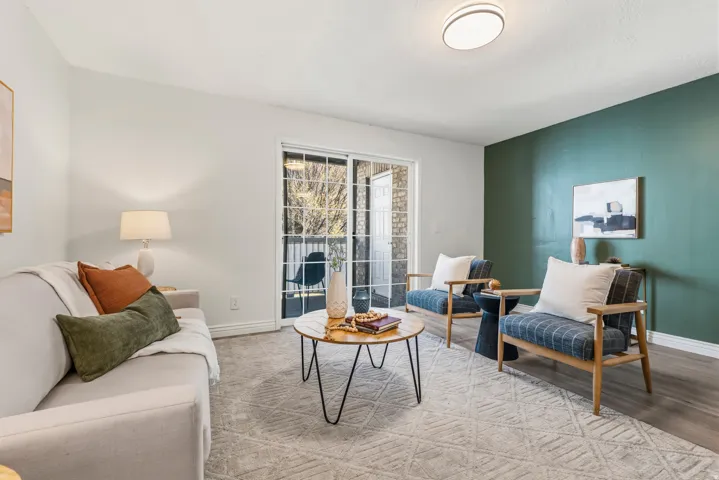 Living area featuring baseboards and wood finished floors