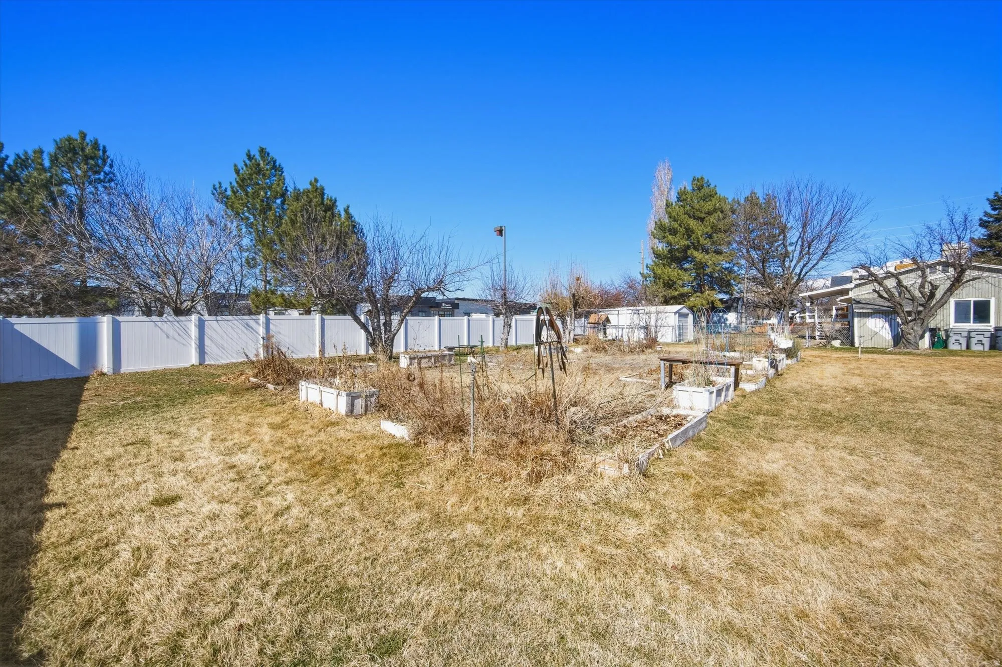 View of yard featuring a garden and a residential view