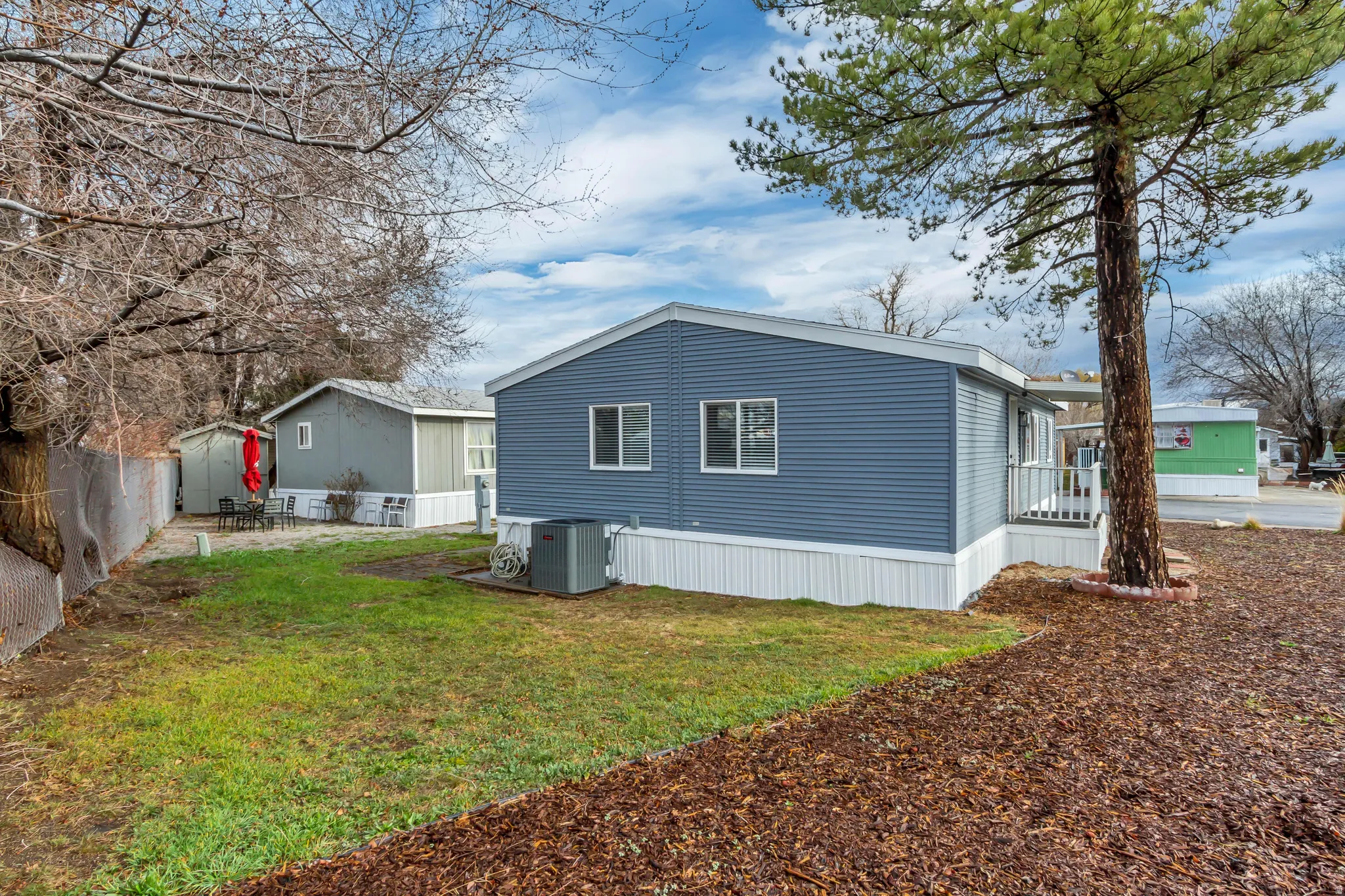 View of side of home with a central AC unit