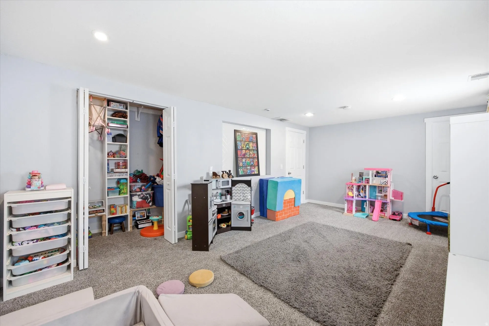 Recreation room featuring recessed lighting and carpet floors