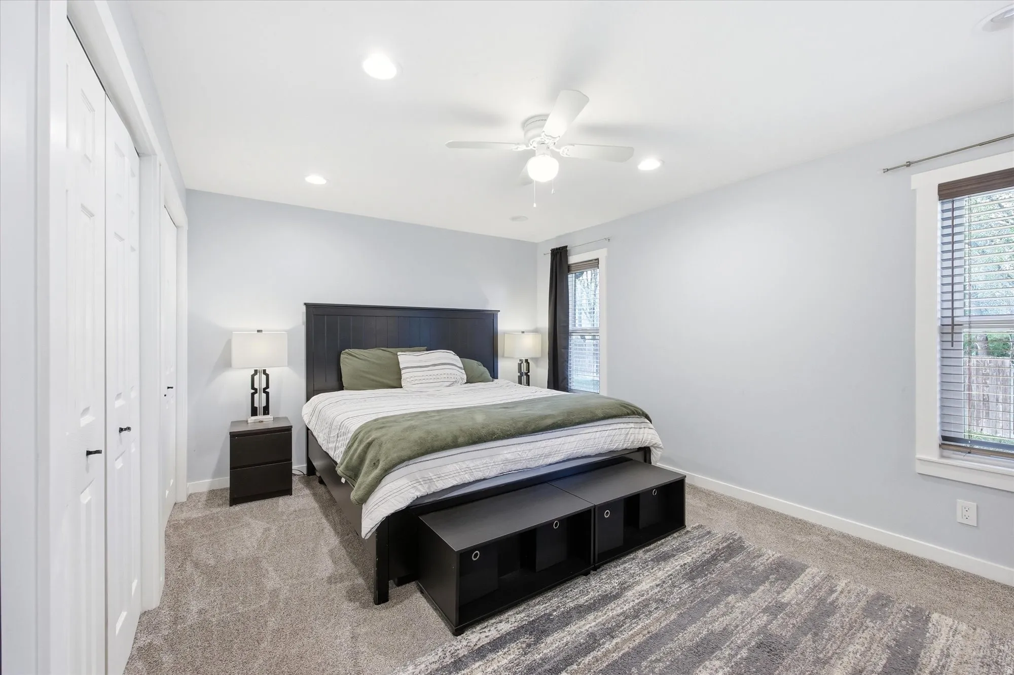Bedroom with carpet flooring, a closet, ceiling fan, and recessed lighting