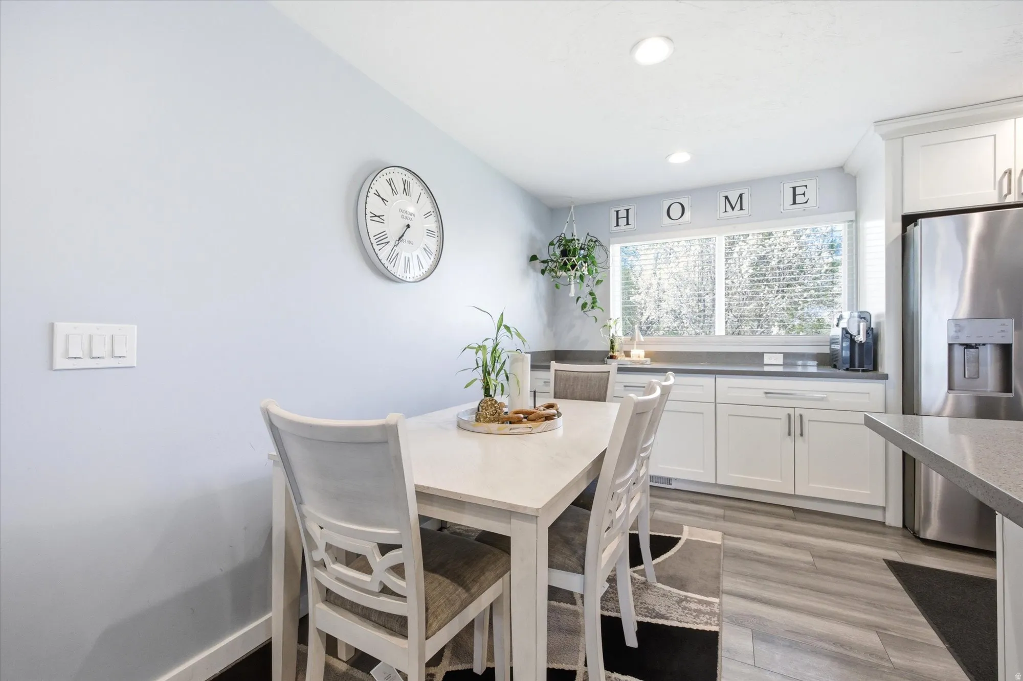 Dining space featuring light wood finished floors and recessed lighting