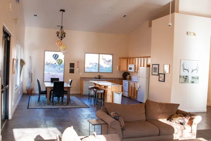 Living area featuring concrete floors and lofted ceiling