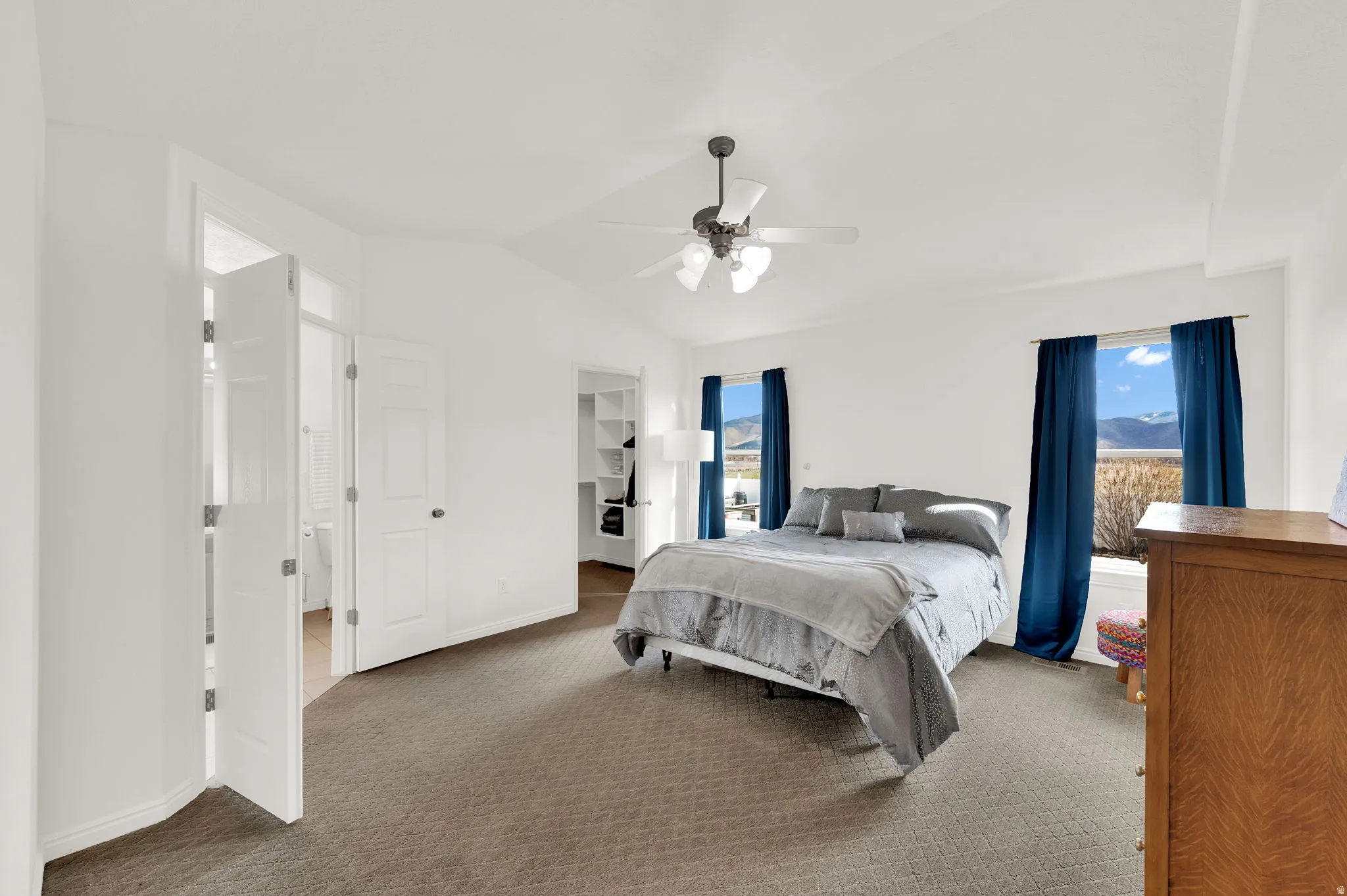 Primary suite featuring walking closet and picture windows