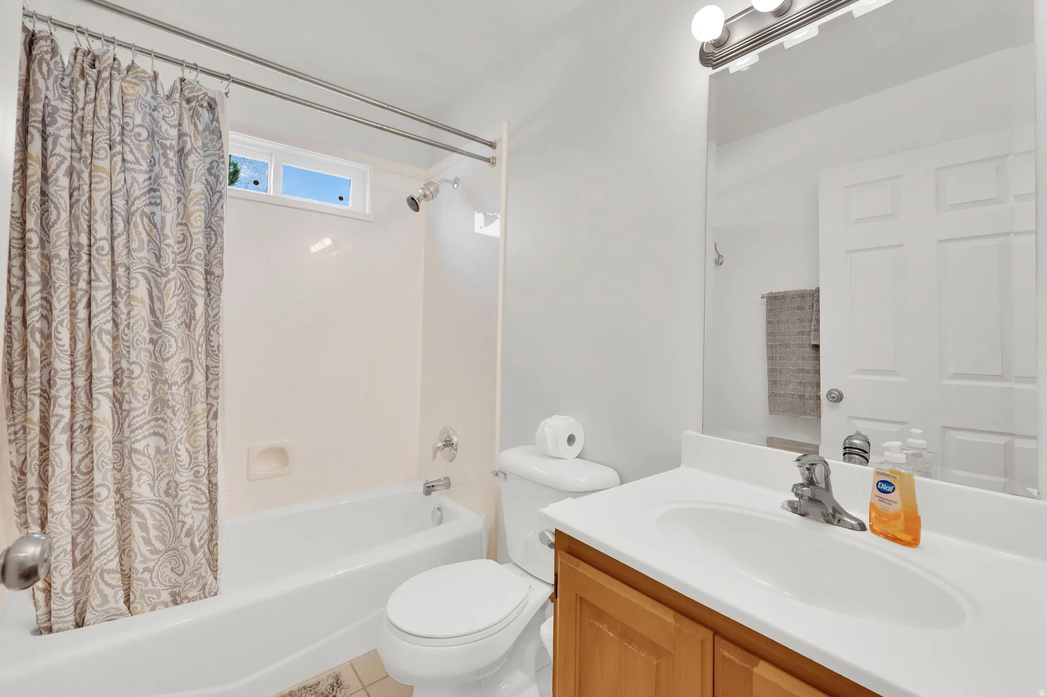 Guest full bath with vanity and shower / bathtub combination.