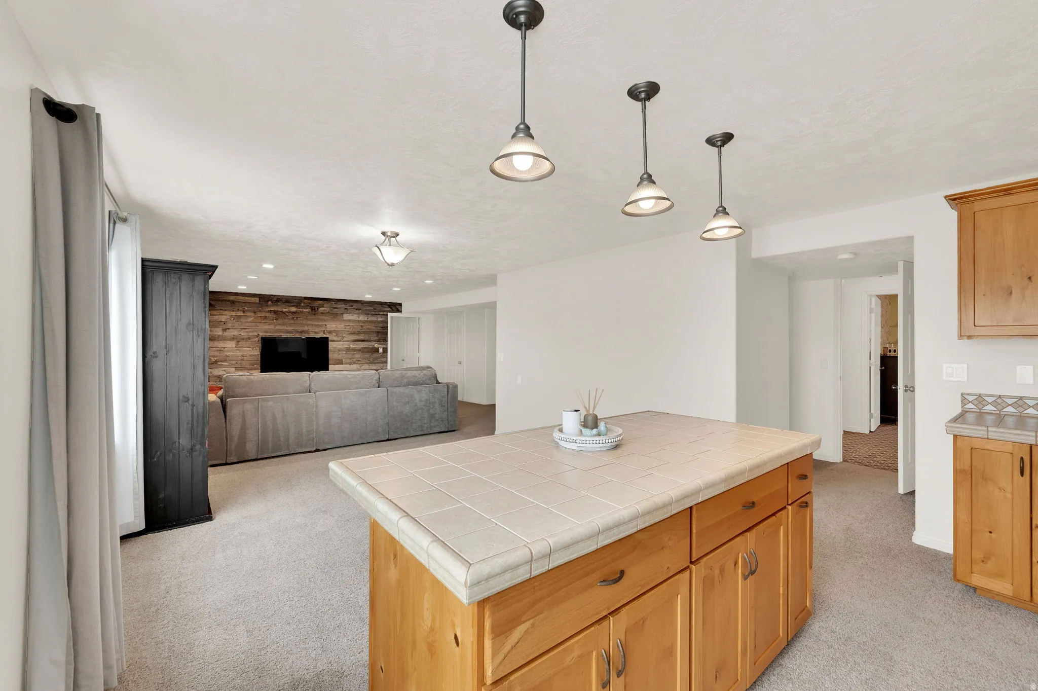 Kitchenette island and dining area viewing rec room