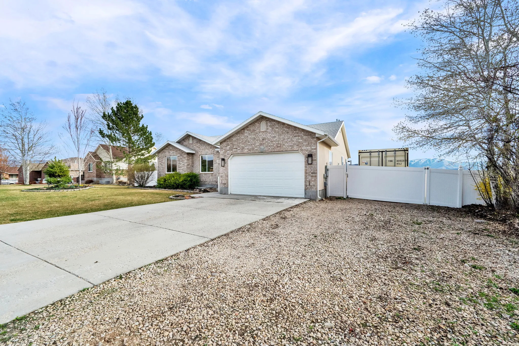 Front of home, RV parking & 2-car garage