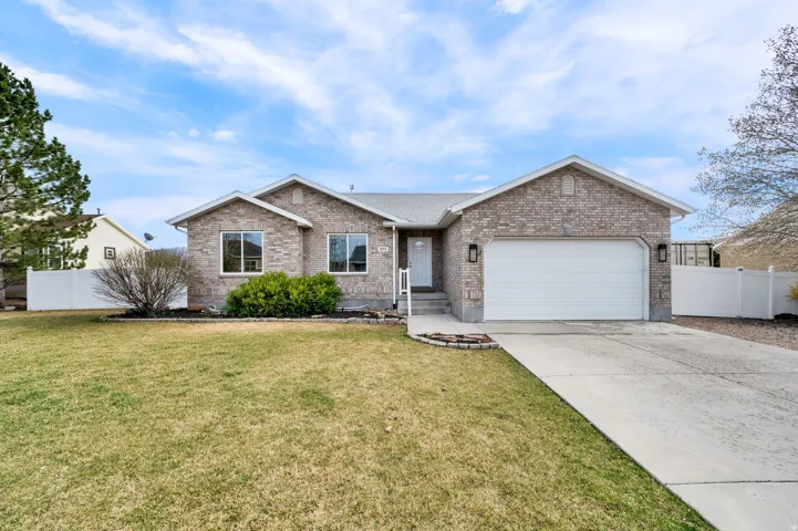 Front of home, brick rambler, 2-car garage