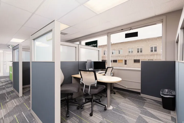 Office featuring a drop ceiling and healthy amount of natural light